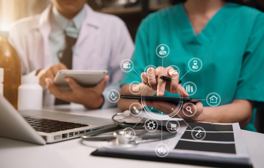 healthcare digital marketing_Doctors working together on digital tablet healthcare doctor technology tablet using computer in a modern office.