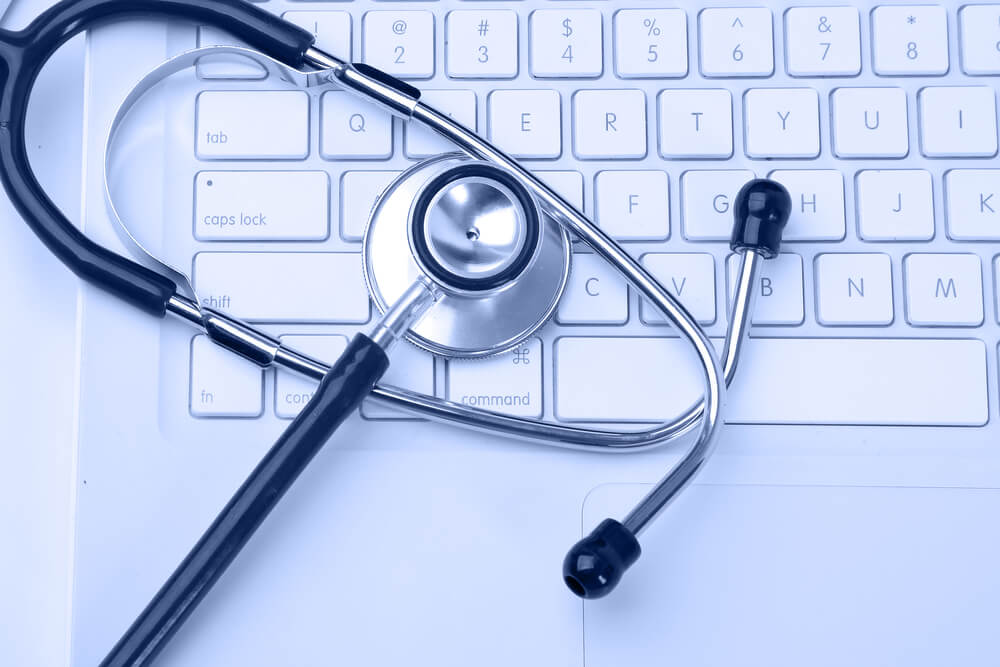 healthcare email_Silver stethoscope over laptop keyboard