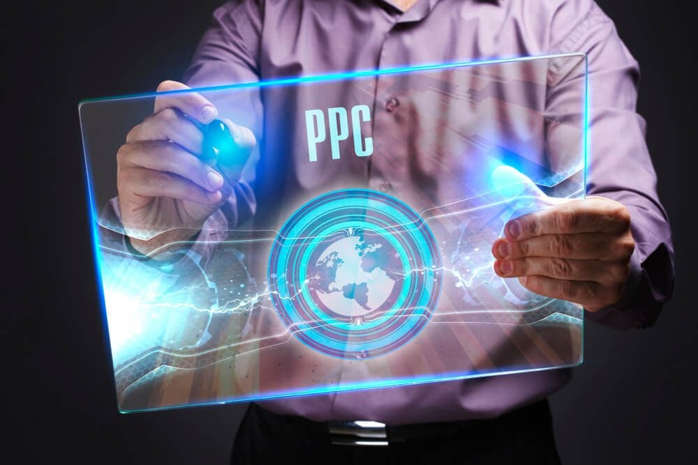 ppc_The concept of business, technology, the Internet and the network. A young entrepreneur working on a virtual screen of the future and sees the inscription: PPC