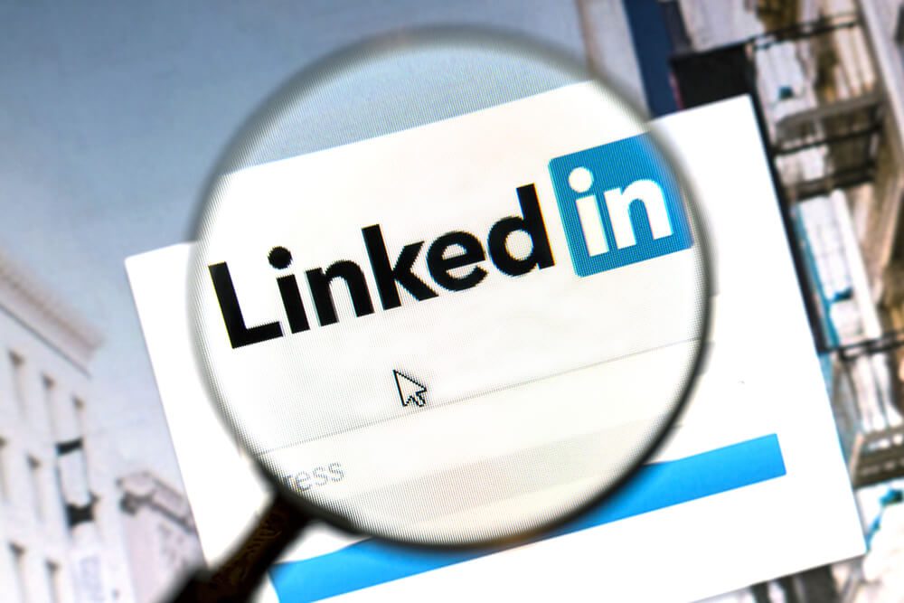 linkedin_Ostersund, Sweden - August 1, 2015: Linkedin website under a magnifying glass. Linkedin is a business oriented social networking website.