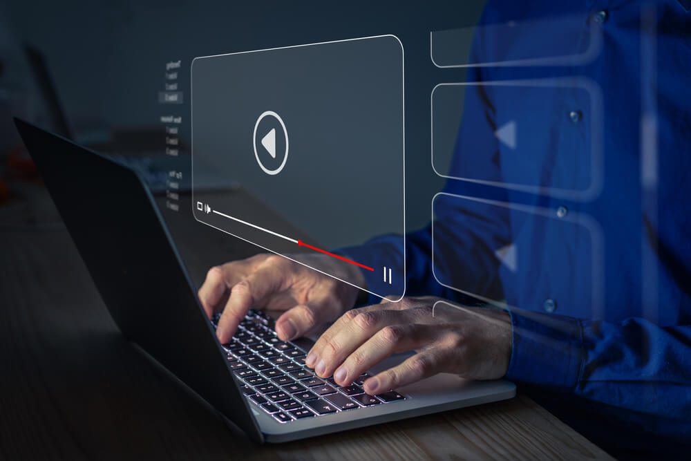 video content_Video streaming on internet. Person watching online movie or TV series on laptop computer screen. Concept about subscription based live digital stream or channels, multimedia player with play button