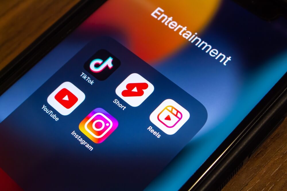 youtube tiktok_Vancouver, CANADA - Sep 27 2022 : TikTok, YouTube Shorts and Instagram Reels icons on an iPhone. Social short video app concept