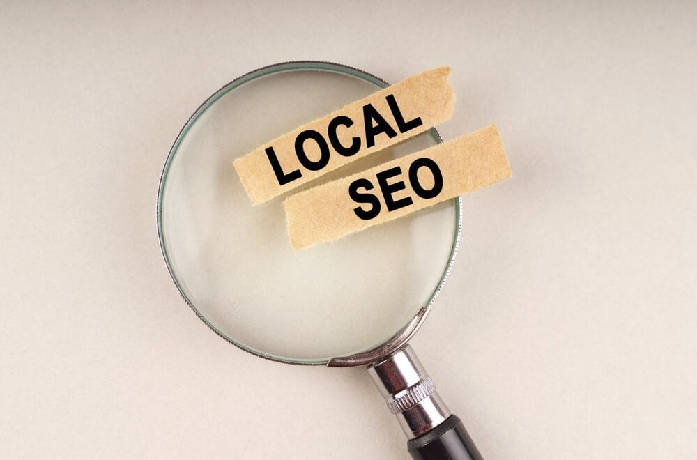 website local seo_On the magnifying glass are paper strips with the inscription - Local Seo.