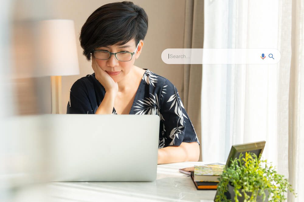 How To Identify and Stop SEO Keyword Cannibalization 1 seo keywords_Search Engine Optimization - SEO concept. Portrait of a beautiful middle-aged asian woman using laptop computer a on the table. Machine learning, AI Artificial intelligence, Keyword, Lifestyle.