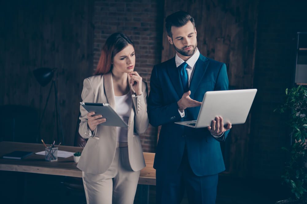 seo mistake_Close up photo attentive she her thoughtful business lady he him his guy boss seo employer banker manager coacher look watch check materials show mistakes office wearing formal wear suit