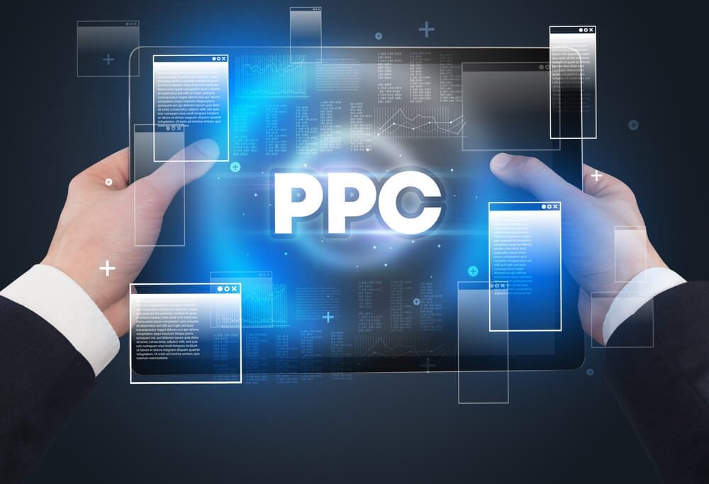ppc_Close-up of a hand holding tablet with PPC abbreviation, modern technology concept
