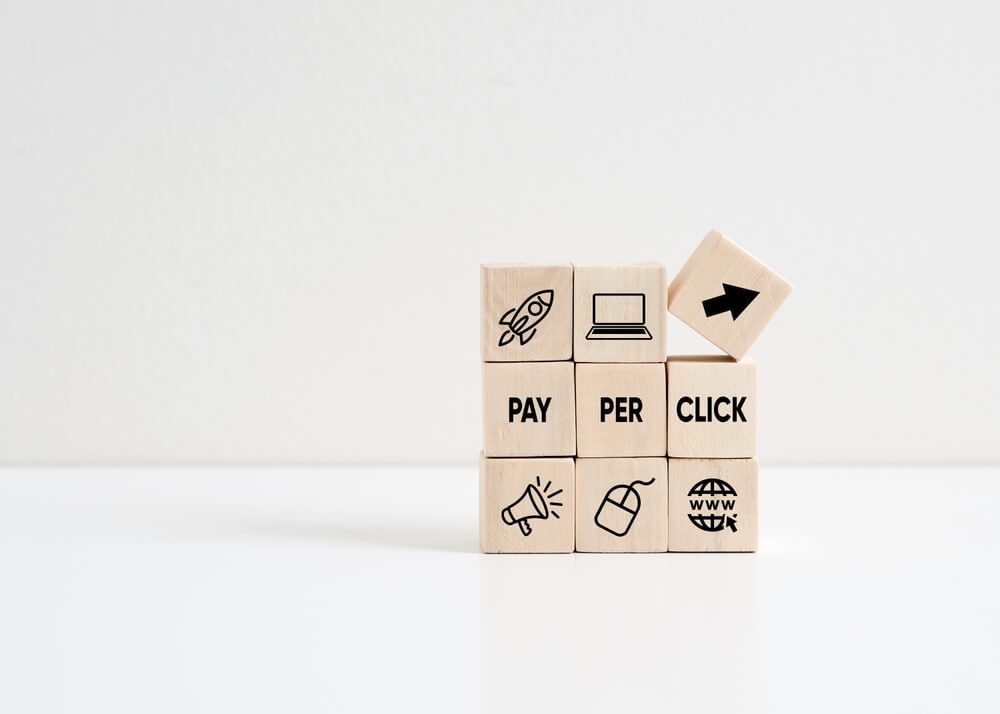 ppc_PPC Pay Per Click concept. Internet marketing business concept. Wooden cubes with ppc symbols and text.