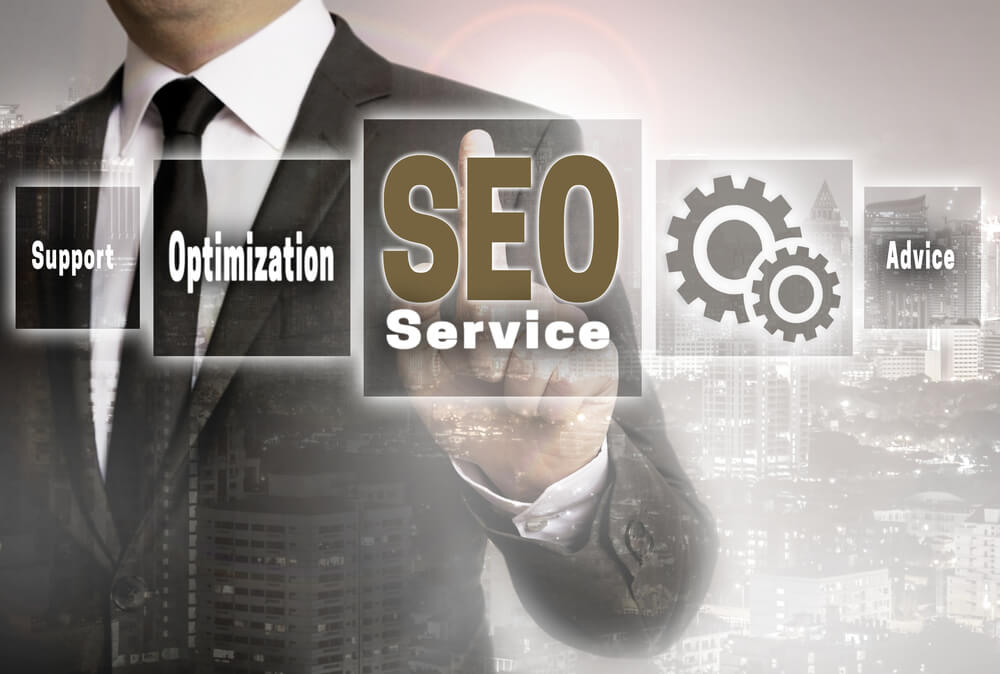 seo service_SEO service businessman with city background concept.