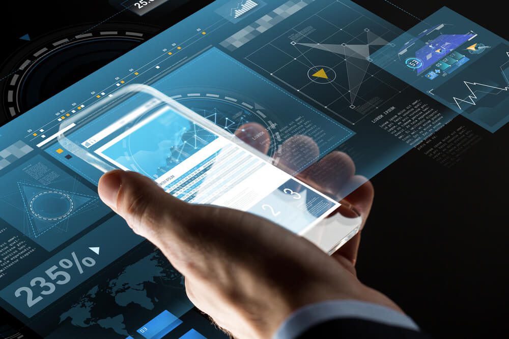 mobile app_business, statistics, people and future technology concept - close up of businessman hand with charts on transparent smartphone screen and virtual projections over black background