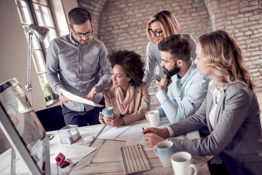 marketing strategy_Group of business people working on business project in modern office.