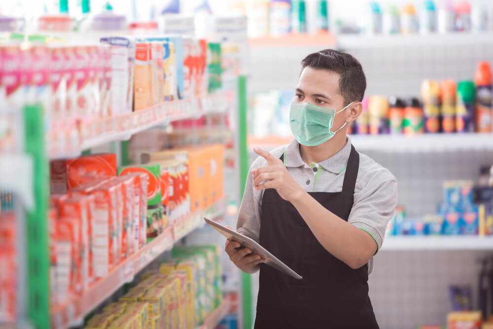 grocery store_asian male shopkeeper working in a grocery store