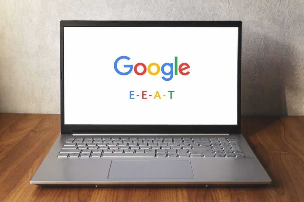 E-E-A-T_Google E-E-A-T on laptop screen on desk. Quality Rater Guidelines update. Experience added. Warsaw, Poland - December 17, 2022.
