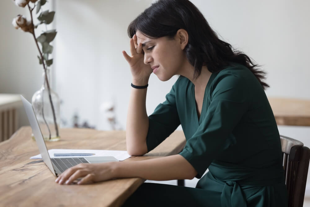 website mistake_Upset sad entrepreneur woman facing problems with laptop, app wrong work, software error, finding professional mistakes, receiving bad news, feeling stressed, headache, touching head at office table