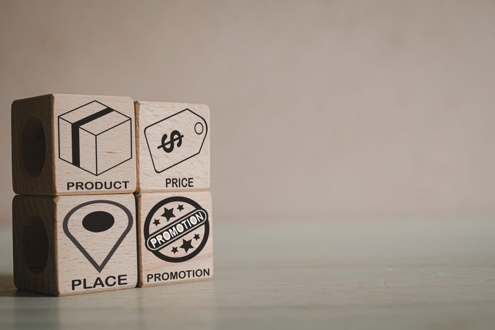 4Ps_4Ps or PPPP of marketing concept.,PRODUCT,PRICE,PLACE,PROMOTION icon and word on wooden cubes in left corner image with copyspace for put text or logo.