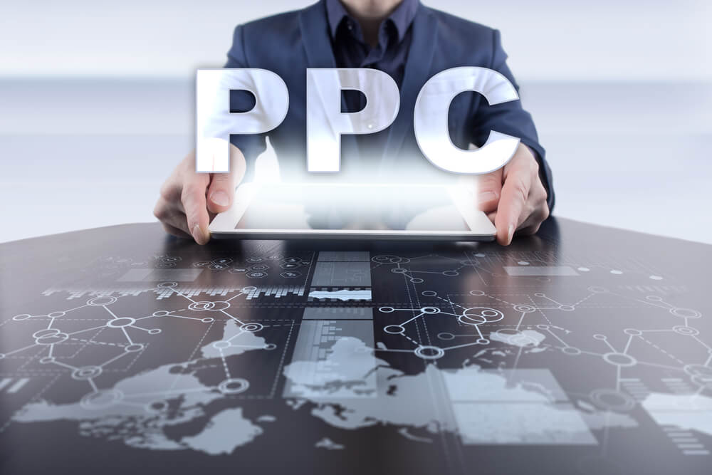 ppc_Businessman using tablet pc and selecting ppc.