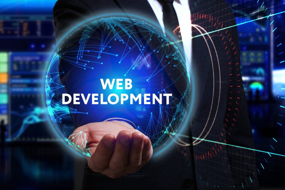 web development_Business, Technology, Internet and network concept. Young businessman working in the field of the future, he sees the inscription: web development