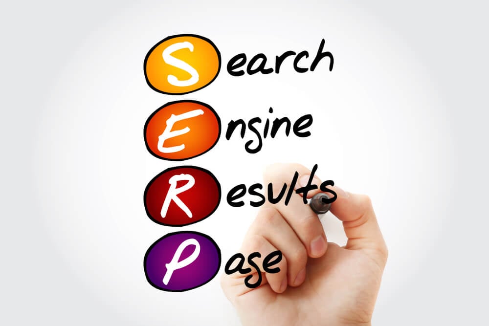 SERP ranking_Hand writing SERP - Search Engine Results Page acronym with marker, concept background