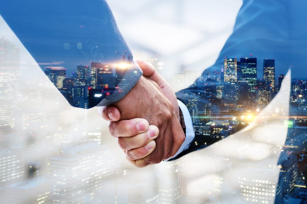 digital marketing partner_Partnership. multi exposure of investor businessman handshake with partner for successful meeting with night city background, digital technology, investment, negotiation, partnership, teamwork concept