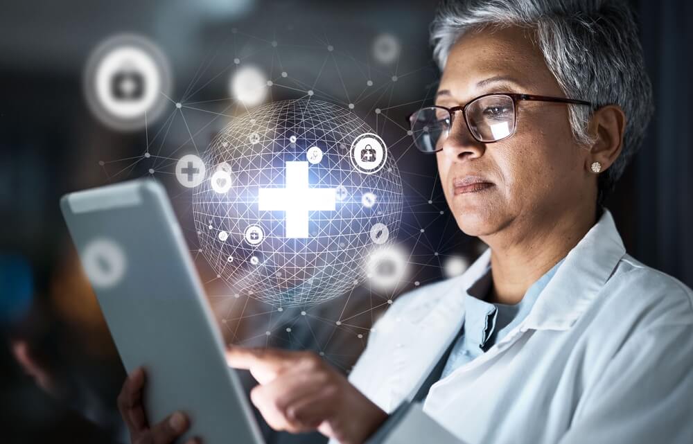healthcare custom software_Doctor, tablet or futuristic global healthcare on cybersecurity, life insurance or data safety app on night hospital network. Thinking, woman or medical technology hologram and overlay for research