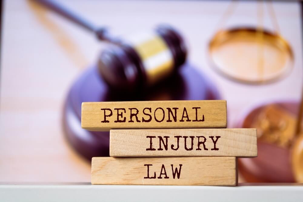 personal injury law_Wooden blocks with words 'Personal Injury Law'. Legal concept