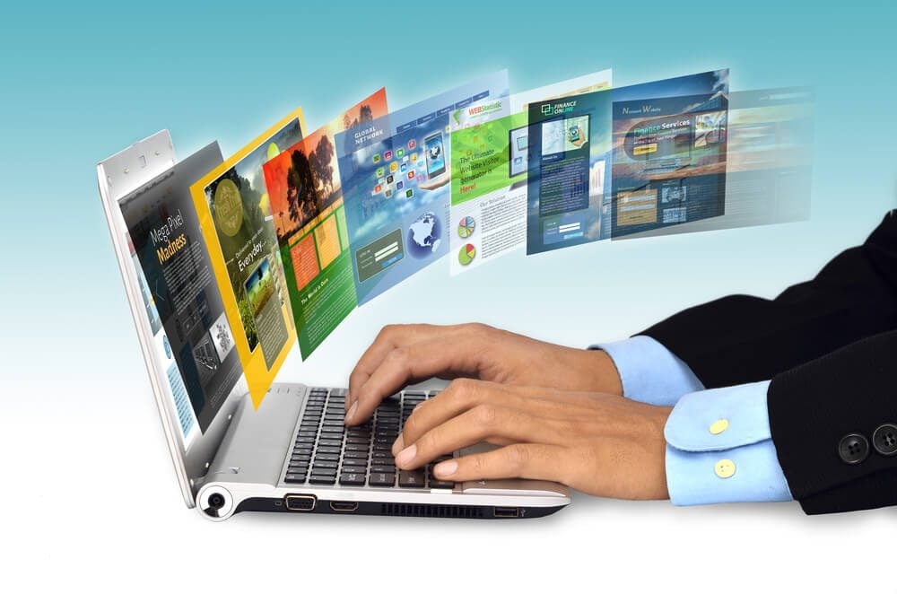 web designer_Businessman hand browsing internet websites on his laptop