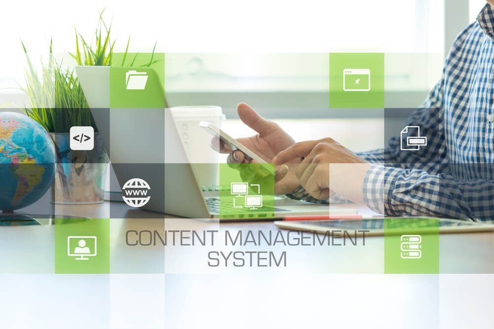 content management system_Businessman working in office and Content Management System icons concept