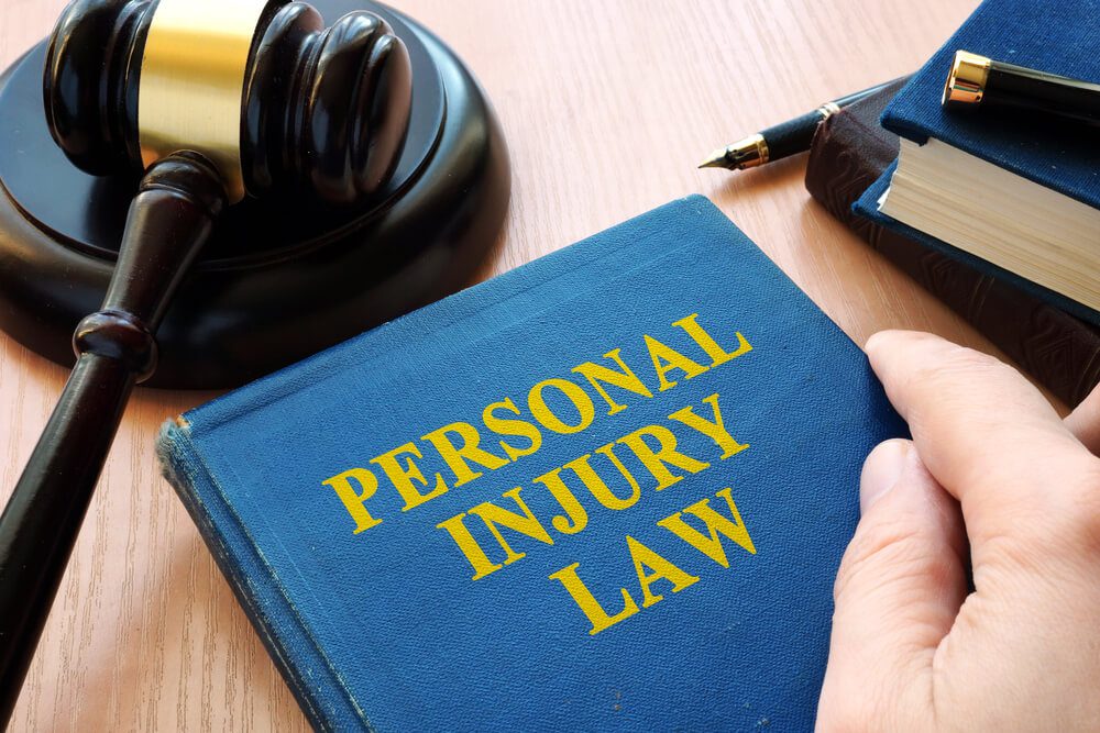 personal injury law_Personal injury law and gavel on a desk.
