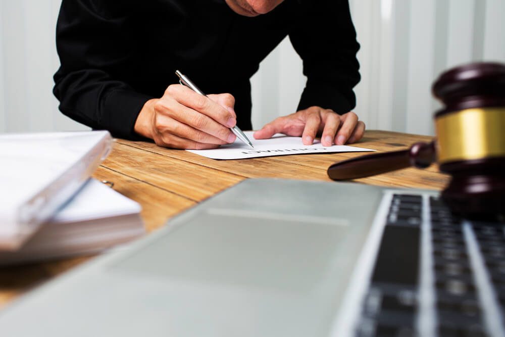 personal injury lawyer_Young lawyer working hard alone in his office.