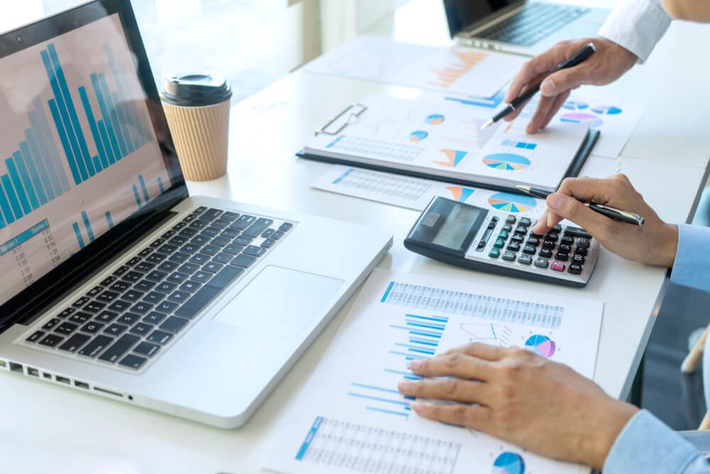 market analytics_businessman in meeting analysis chart graphy marketing plan in business financial audit project. Or Business adviser analyzing Budget.