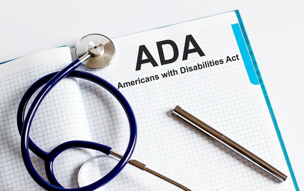 ADA compliance_Paper with Americans with Disabilities Act ADA on a table