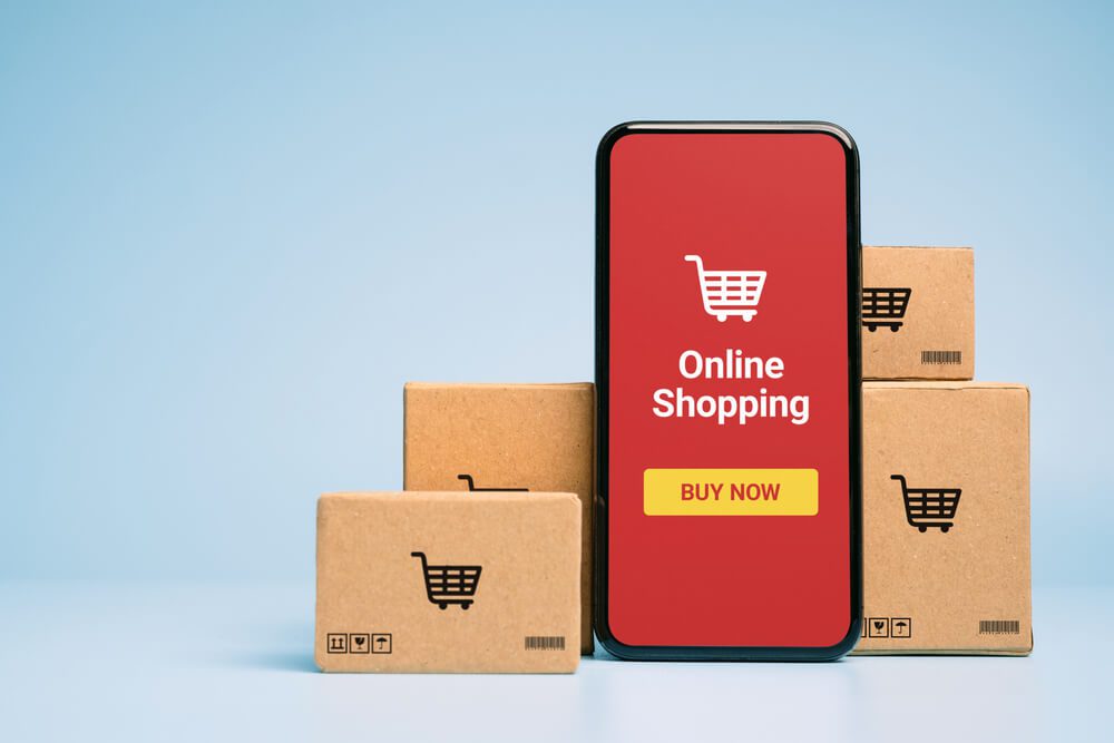 ecommerce_Concept online Sopping. boxes and shopping bag with Smartphone Online Shopping screen.