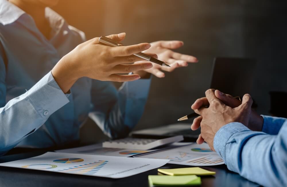 marketing consultant_Close up of hands are working and brainstorming on paperworks about business financial and marketing with ray light.