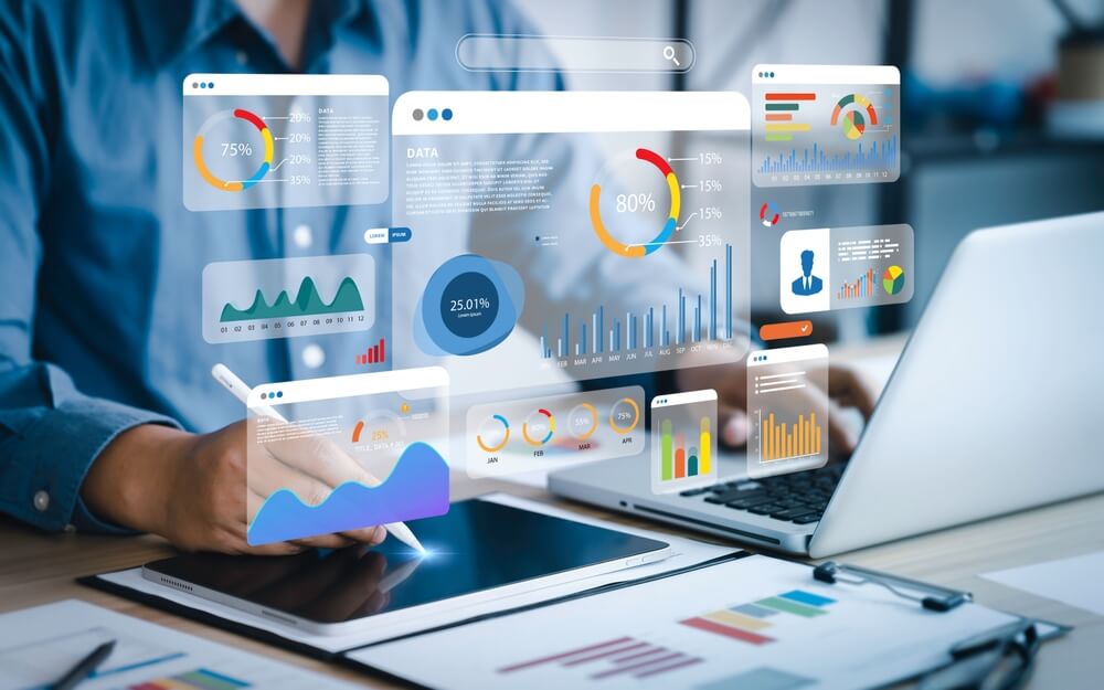 analytics AI_An analyst uses a computer and dashboard for data business analysis and Data Management System with KPI and metrics connected to the database for technology finance, operations, sales, marketing