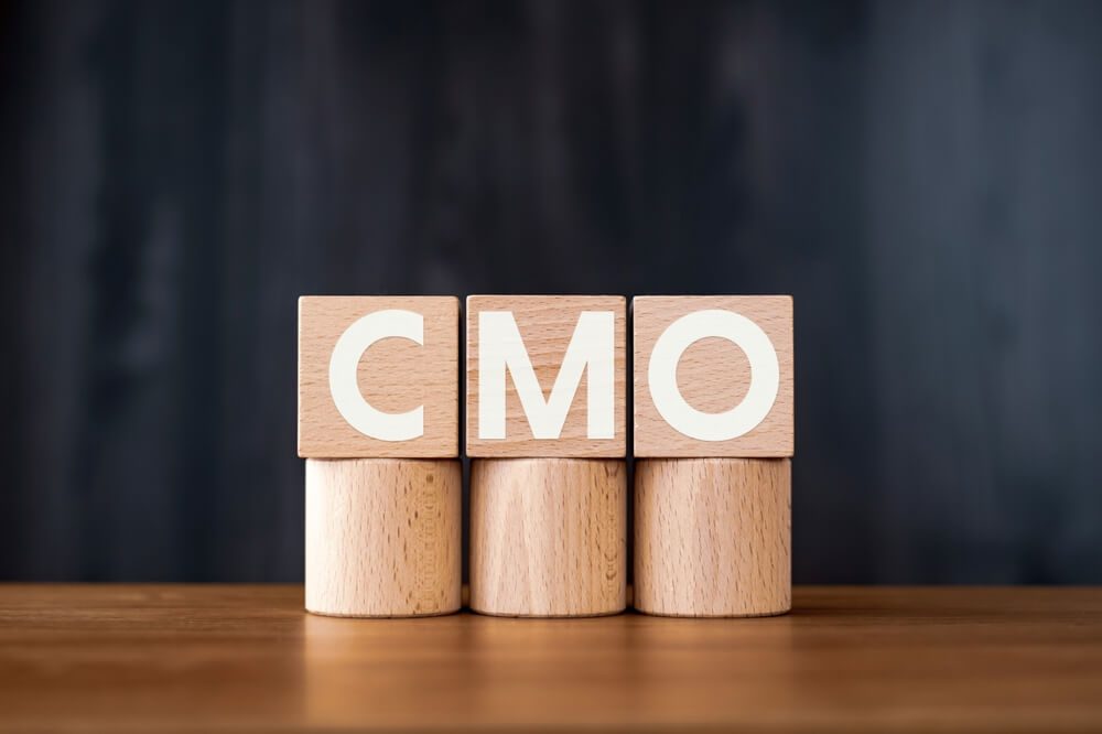 CMO_There is wood cube with the word CMO. It is an abbreviation for Chief Marketing Officer as eye-catching image.