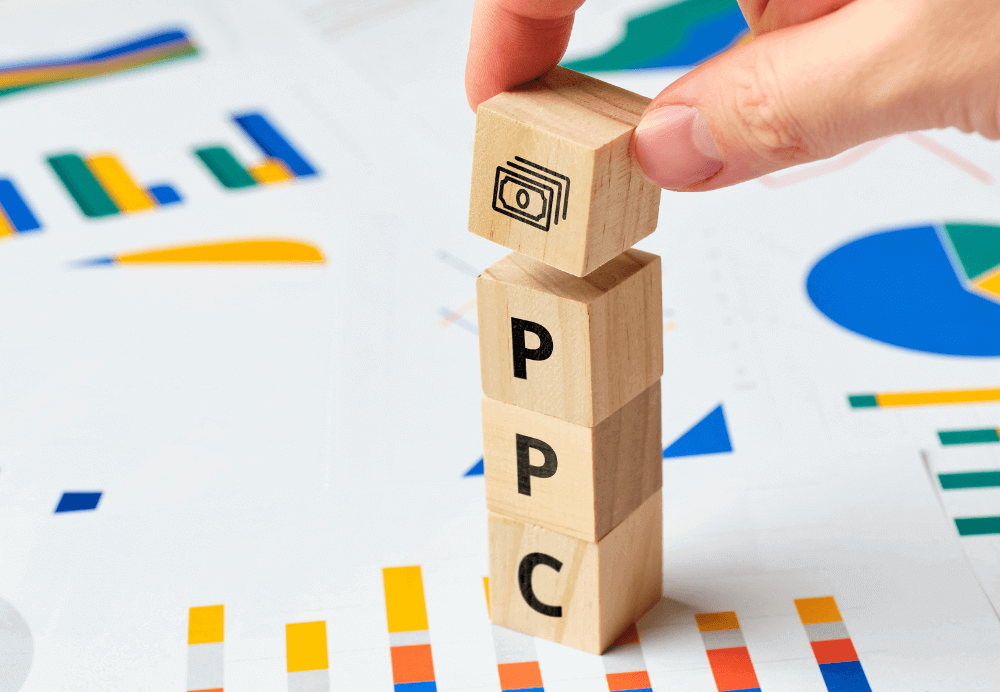 PPC_Pay Per Click PPC on wooden blocks with graphs