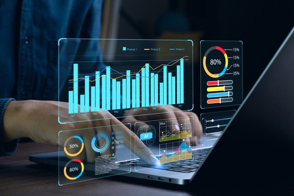 AI analytics_Businessman works on laptop Showing business analytics dashboard with charts, metrics, and KPI to analyze performance and create insight reports for operations management. Data analysis concept.Ai