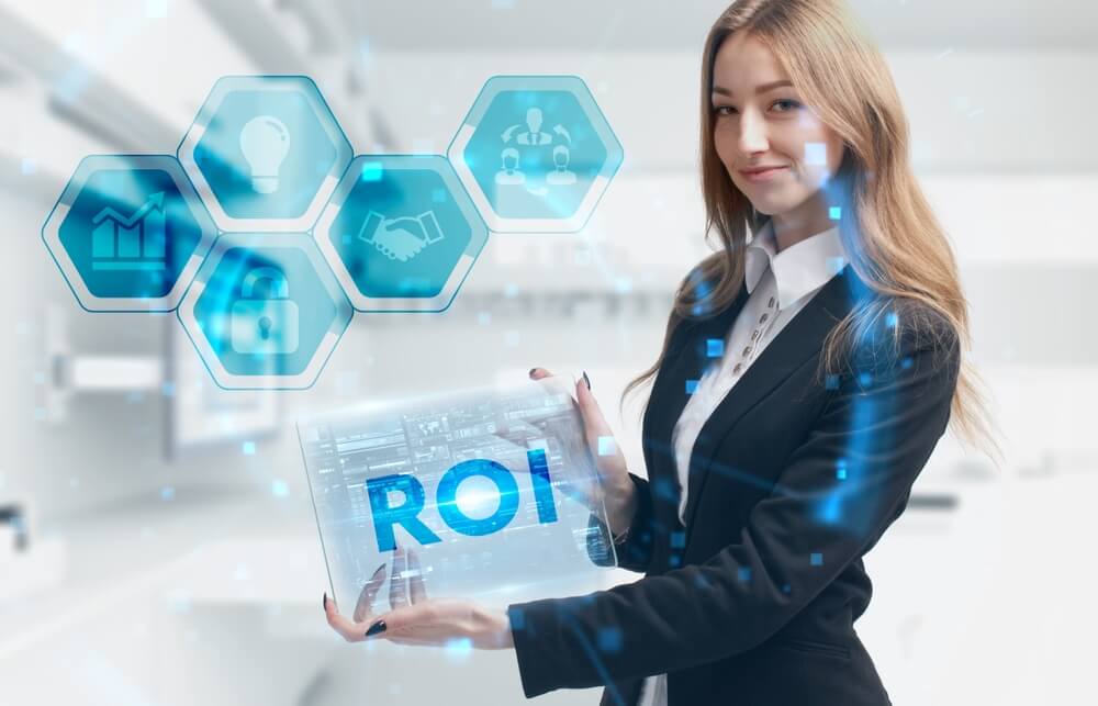 ROI CMO_Business, Technology, Internet and network concept. Young businessman working on a virtual screen of the future and sees the inscription: ROI