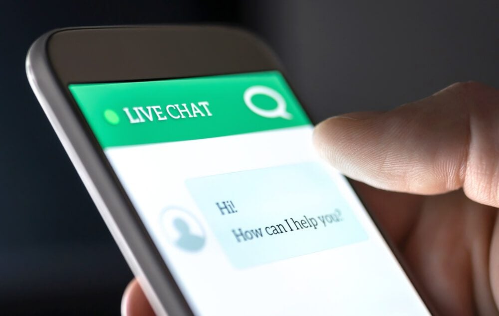chatbot_Customer service and support live chat with chatbot and automatic messages or human servant. Assistance and help with mobile phone app. Automated bot and robot. Smartphone helpdesk for feedback cell.
