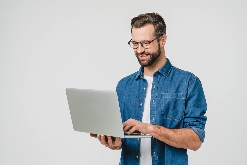 digital consultant_Successful caucasian young man student freelancer using laptop, watching webinars, working remotely, e-learning e-commerce online isolated in white background