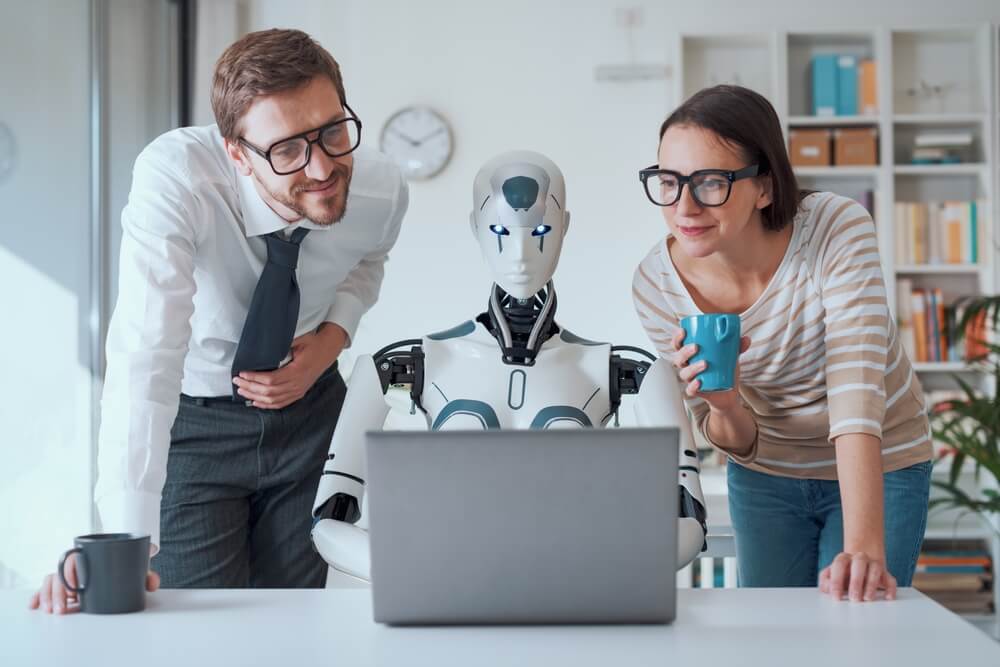 AI demand generation_Happy business people supervising an AI robot working in the office