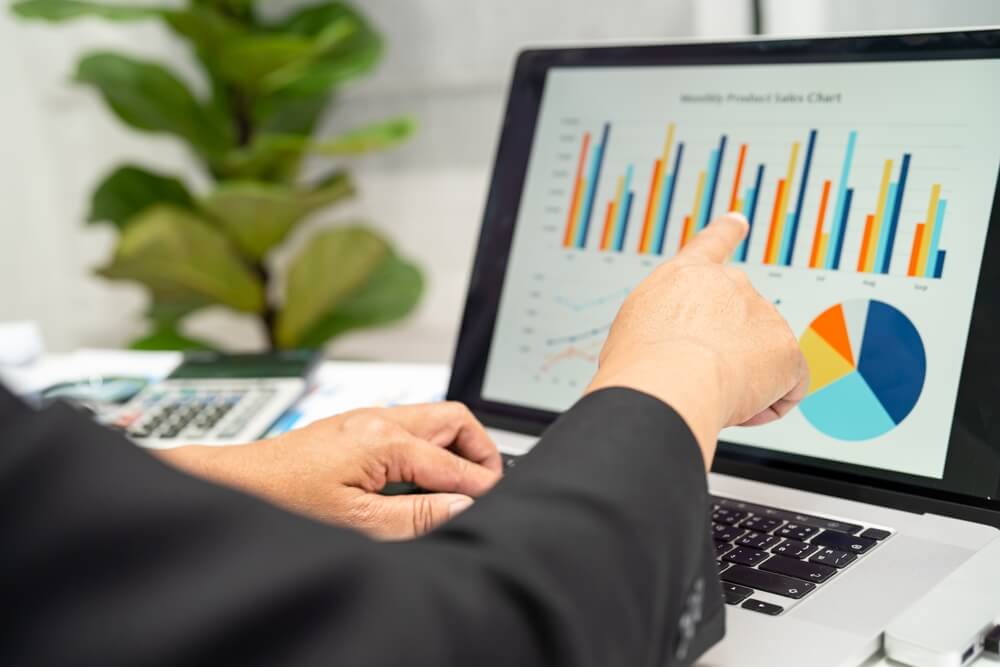 data analysis_Asian accountant working and analyzing financial reports project accounting with chart graph in modern office, finance and business concept.