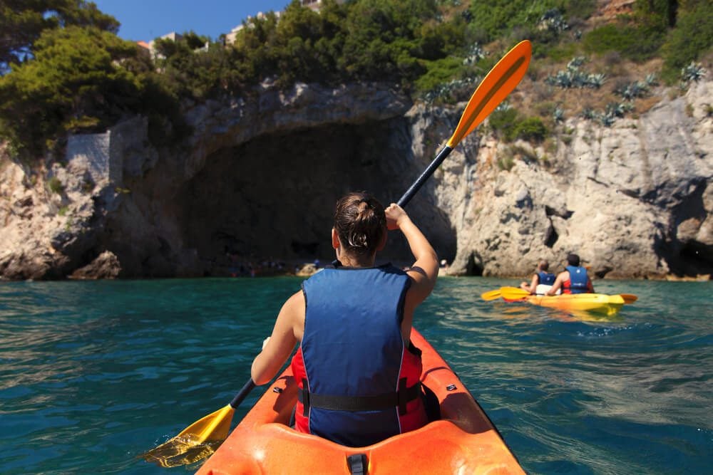 kayak tours_Girl is kayaking on the adriatic sea