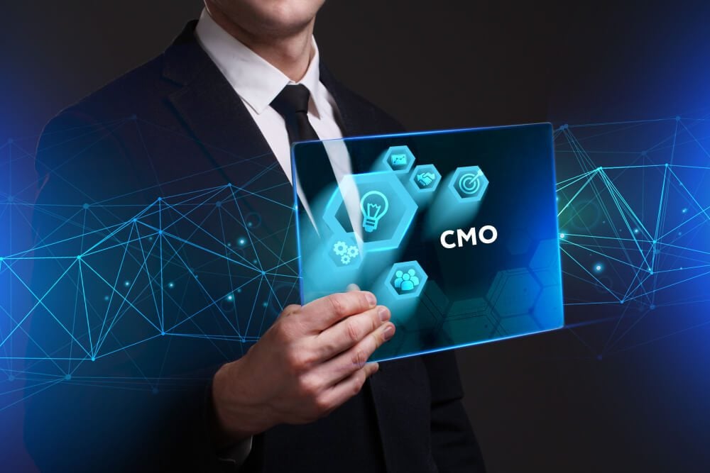 fractional CMO_Business, Technology, Internet and network concept. Young businessman working on a virtual screen of the future and sees the inscription: CMO