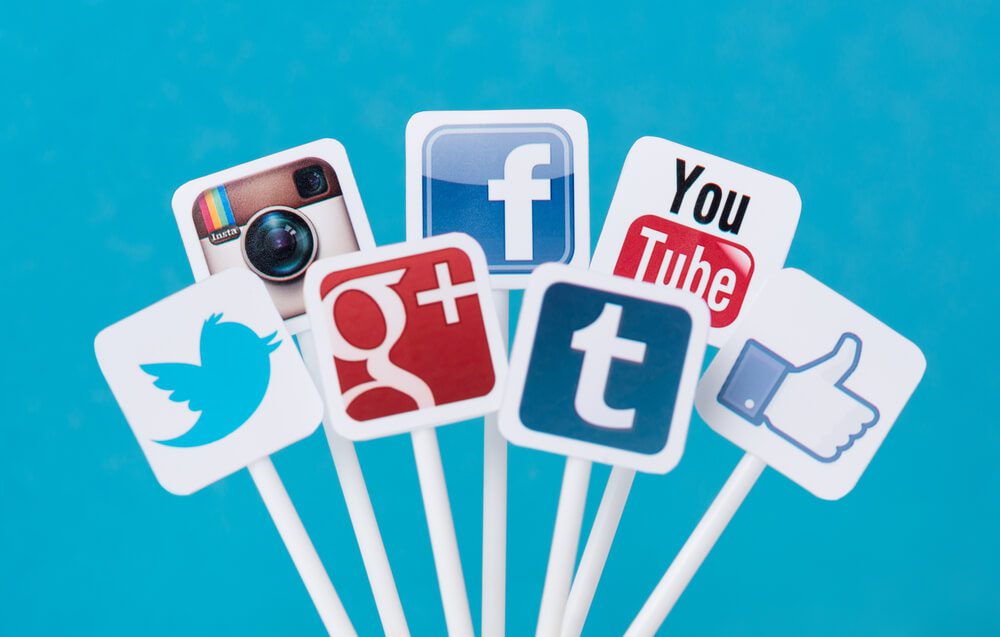 Collection of well-known social media brands printed on paper and placed on plastic signs. Include Facebook, YouTube, Twitter, Google Plus, Instagram and Tumblr logo.