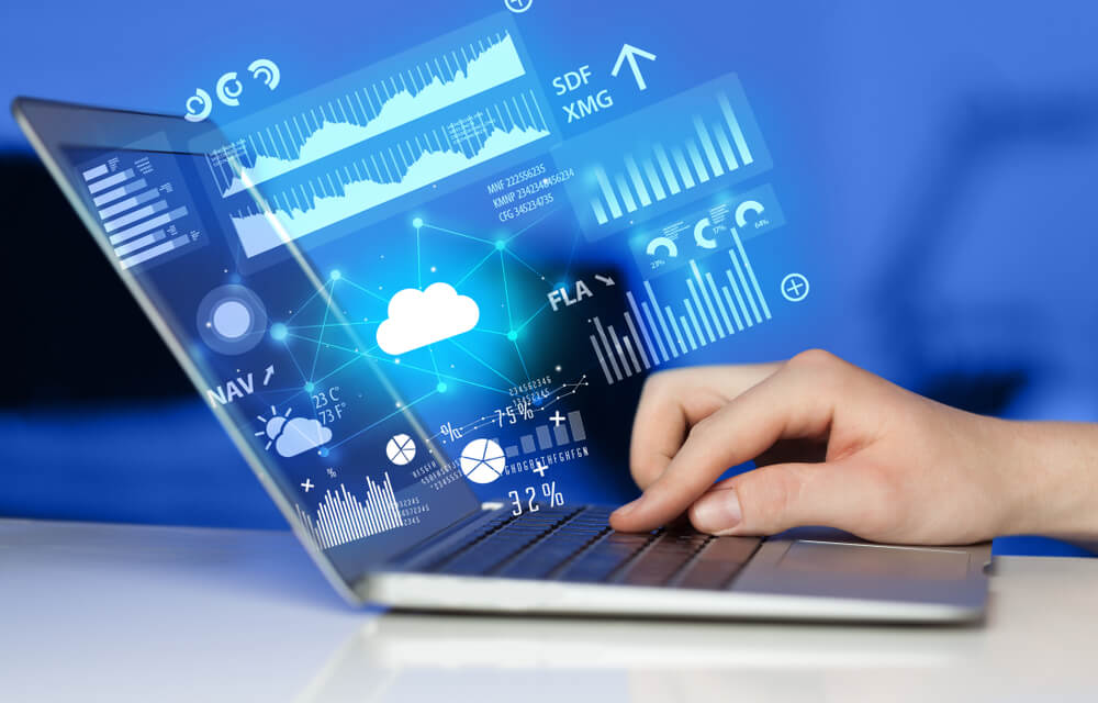 SaaS_Hand using laptop with cloud technology and linked information concept