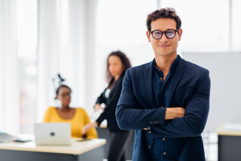 sales management_Business corporate leadership concept. Handsome cheerful hispanic creative business man at workspace office. Portrait