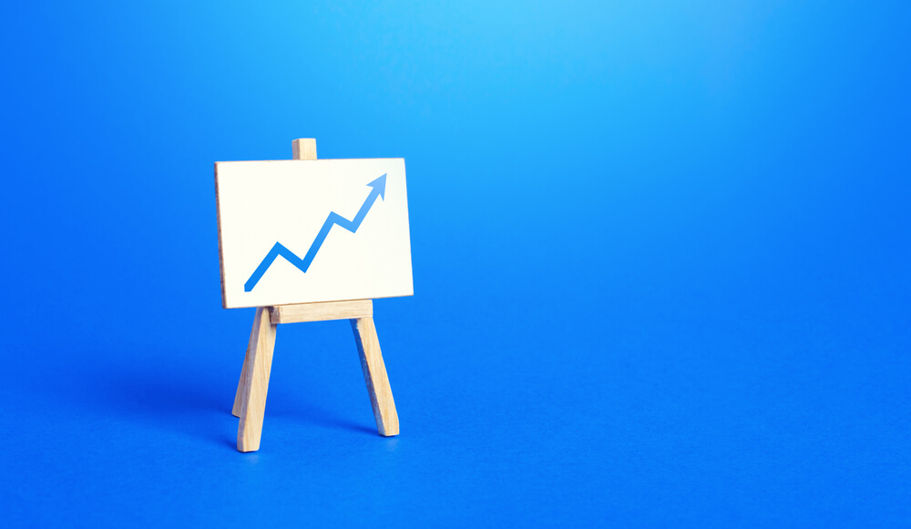 revenue_Easel and up arrow chart. Concept of success, growth and performance improvement. Statistics and business analytics. Income revenue statement analysis. High efficiency, productivity. Economic progress