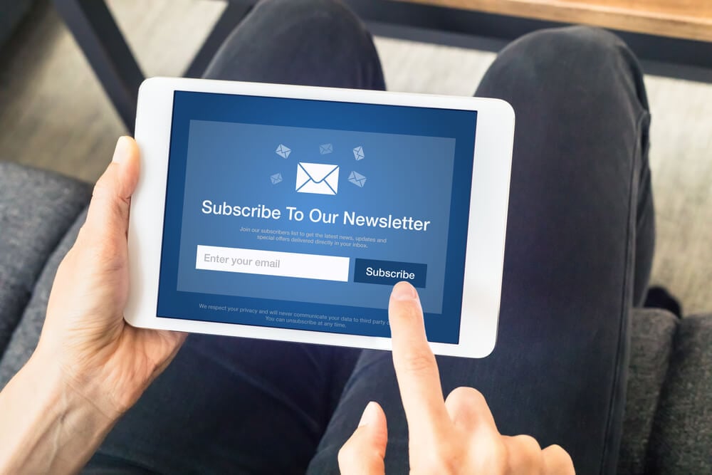 email subscribers_Subscribe to newsletter form on tablet computer screen to join list of susbscribers and receive exclusive offers and update. Digital communication marketing and email advertising. Membership sign-up