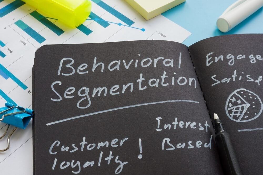 behavioral segmentation_Behavioral segmentation sign with marks on the dark notepad.