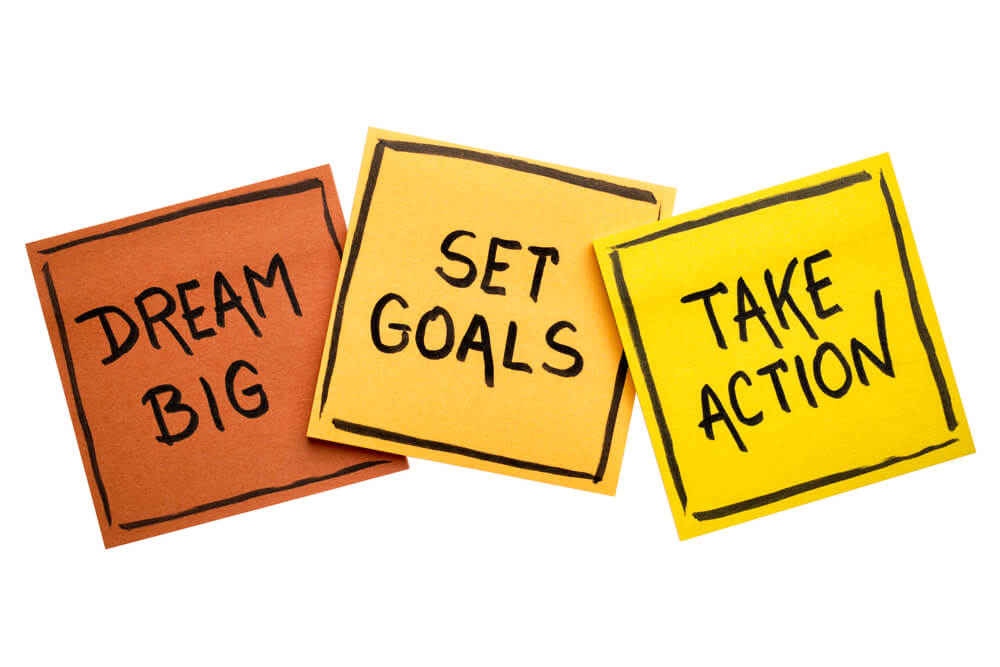 goals_dream big, set goals, take action concept - motivational advice or reminder on colorful sticky notes isolated on white
